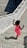 a girl standing on a stone walkway