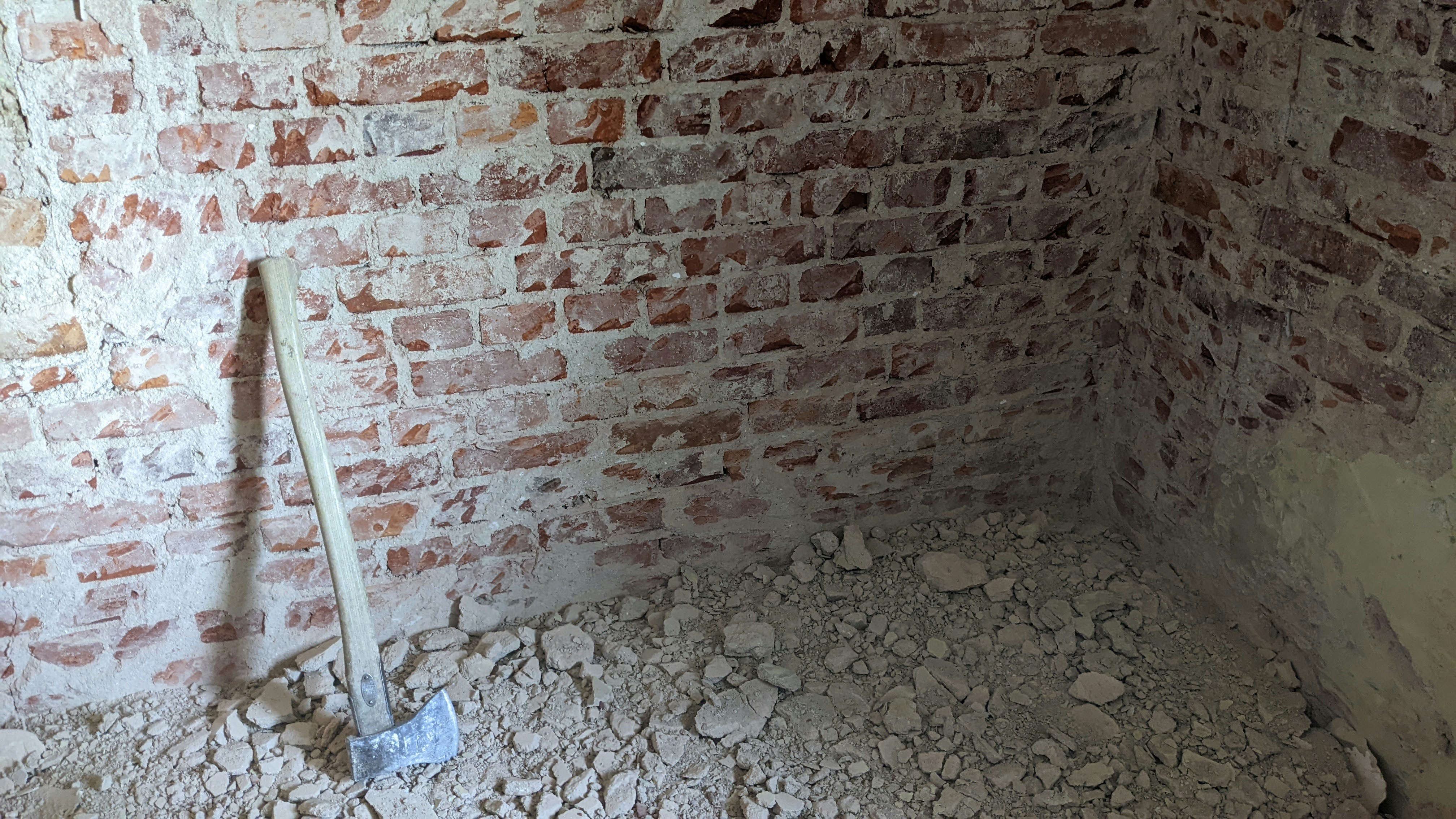 Plaster cleared off an old brick wall