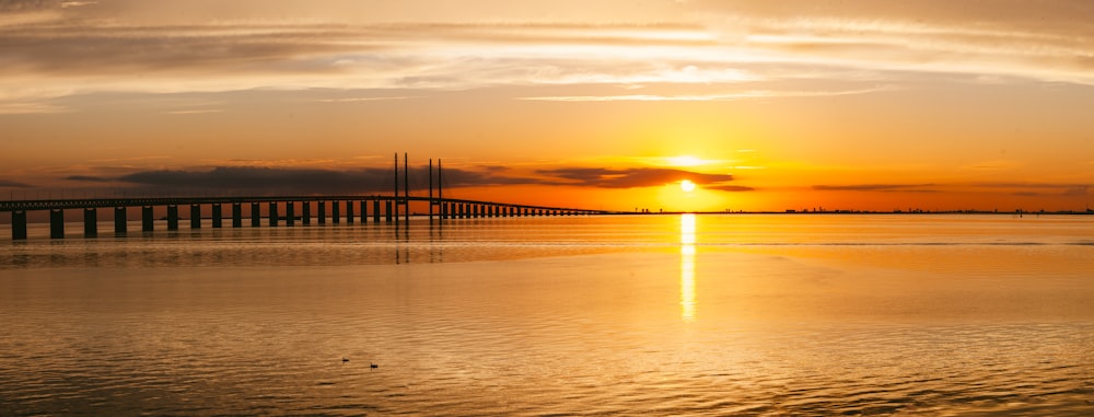 a sunset over a body of water