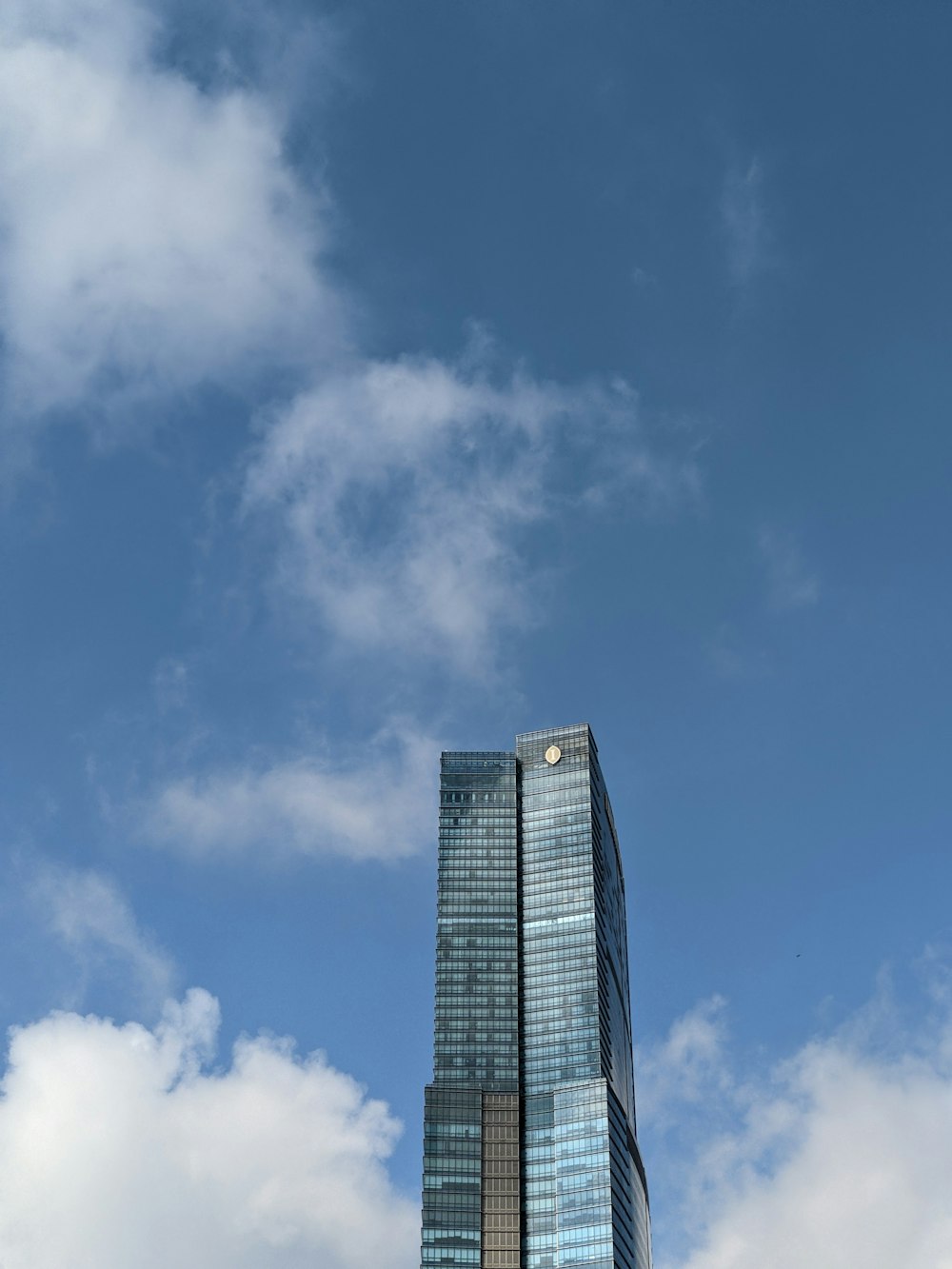 a tall building with a blue sky