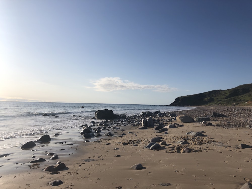 a beach with rocks and water