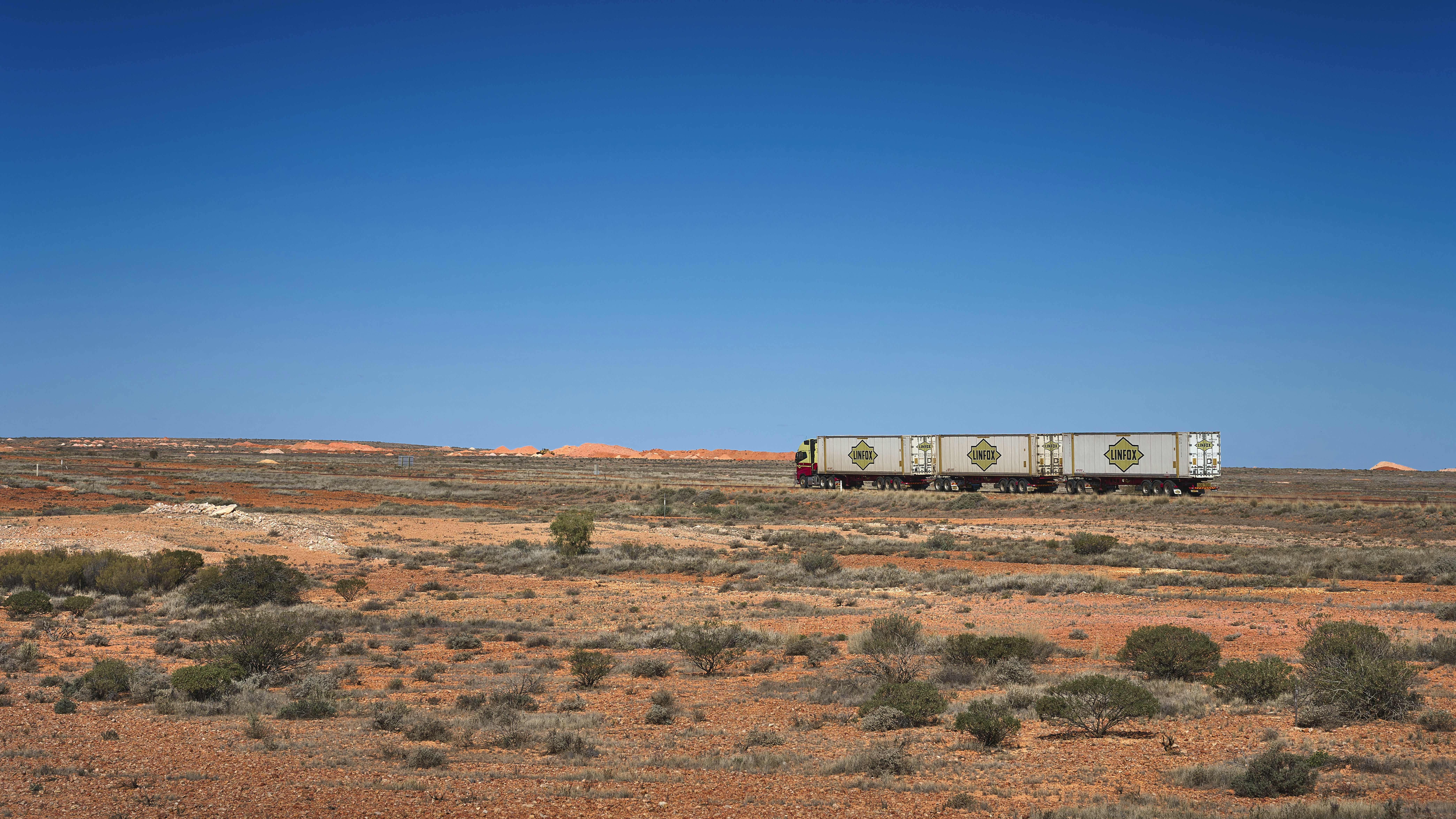 a train traveling through a desert