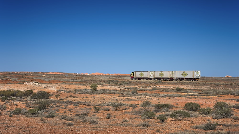 a train traveling through a desert