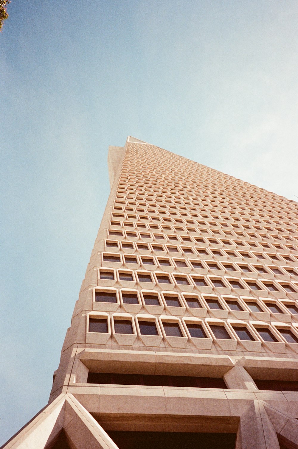 a tall building with a pointed roof