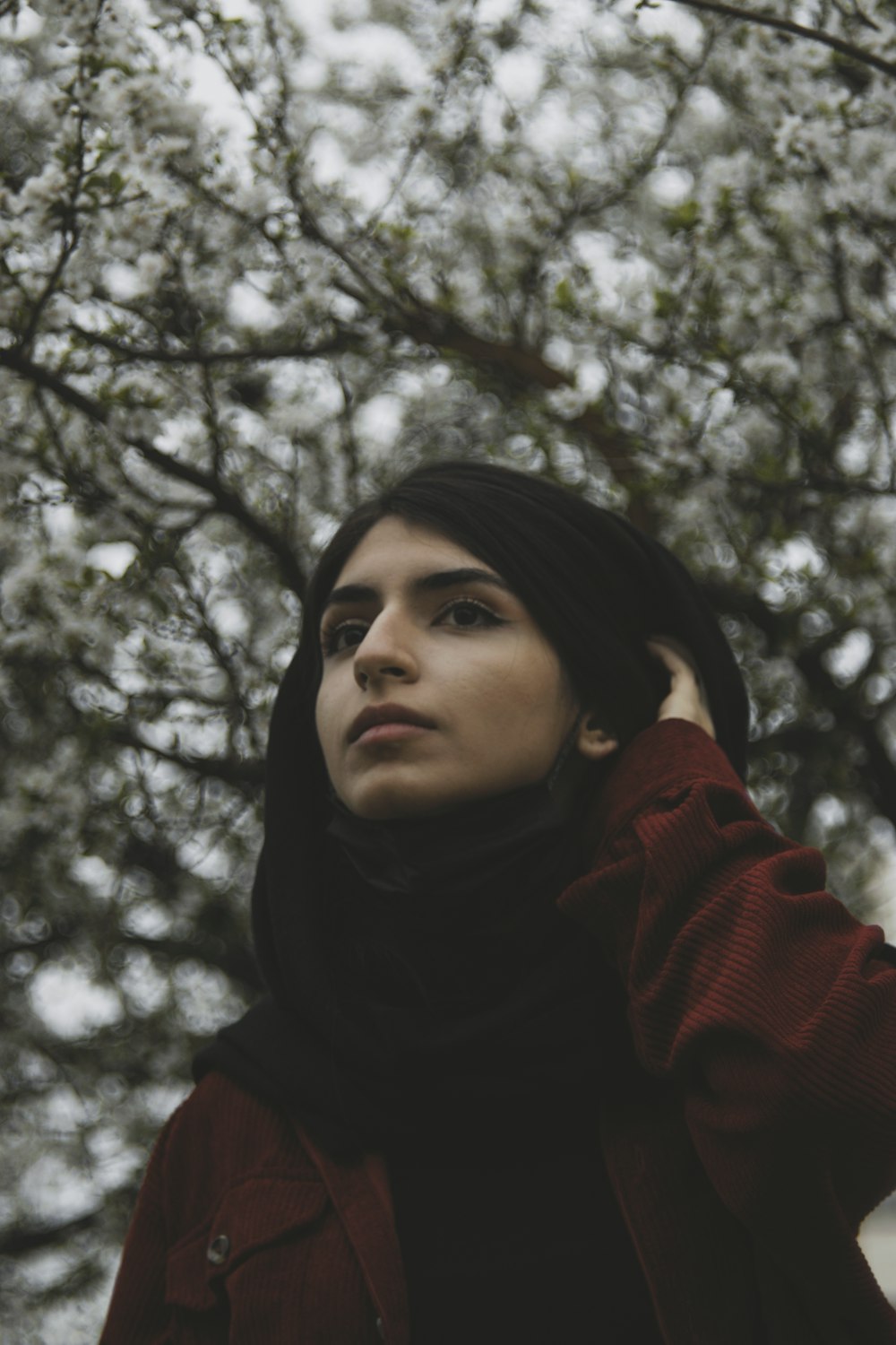 a person standing under a tree