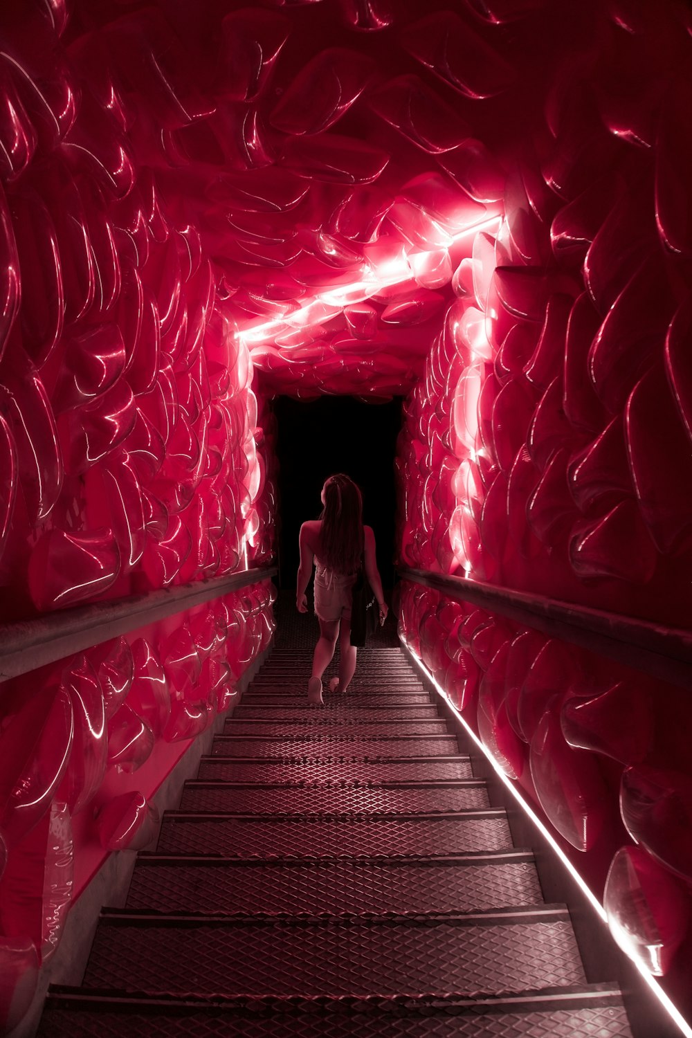 a person standing in a tunnel