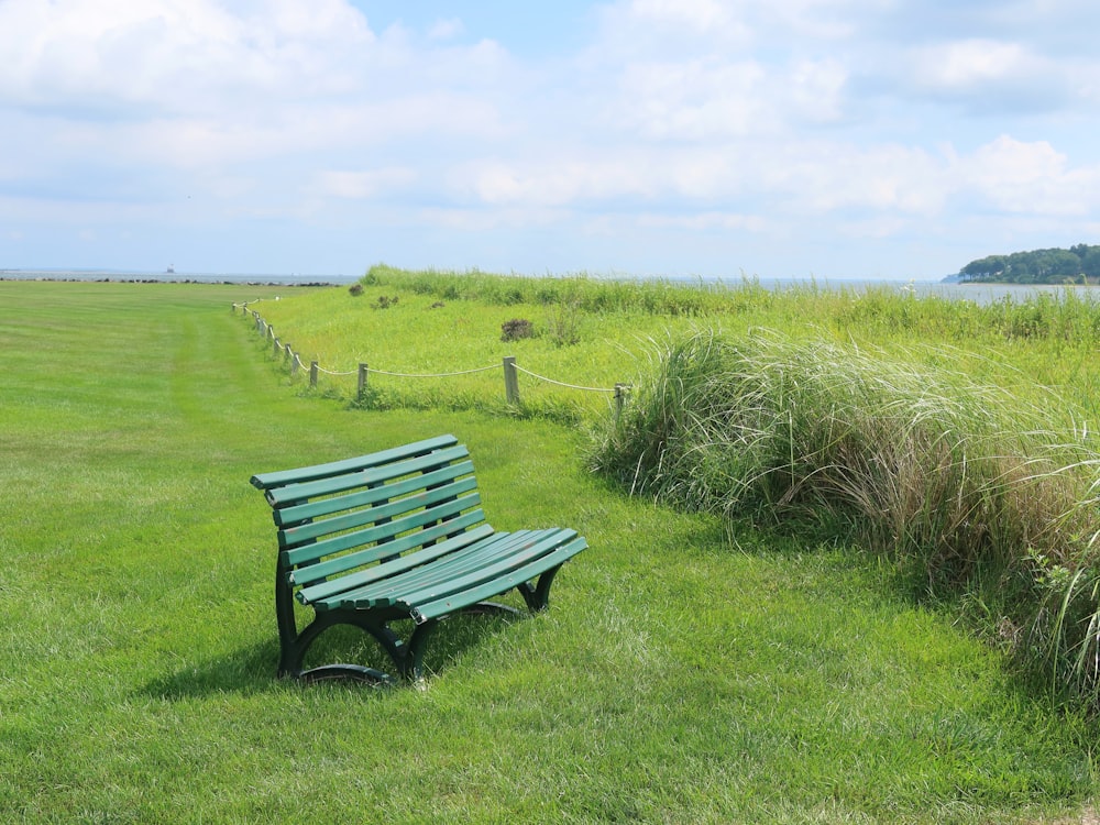 a bench in a field