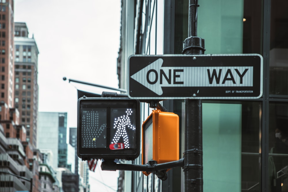 a street sign next to a traffic light