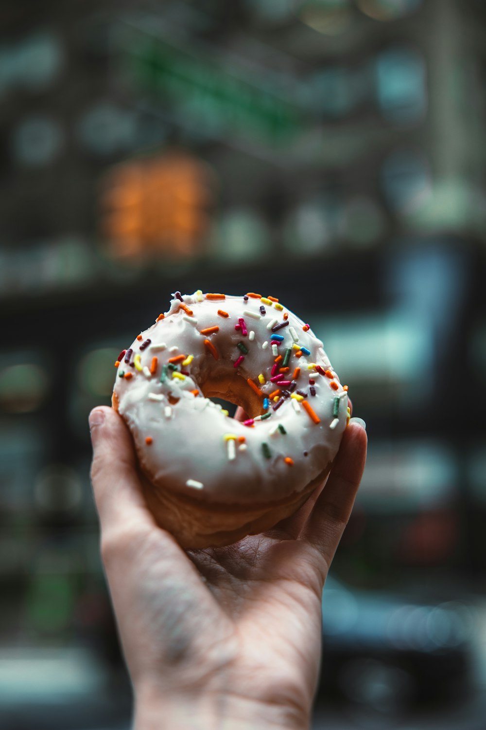 a person holds a donut