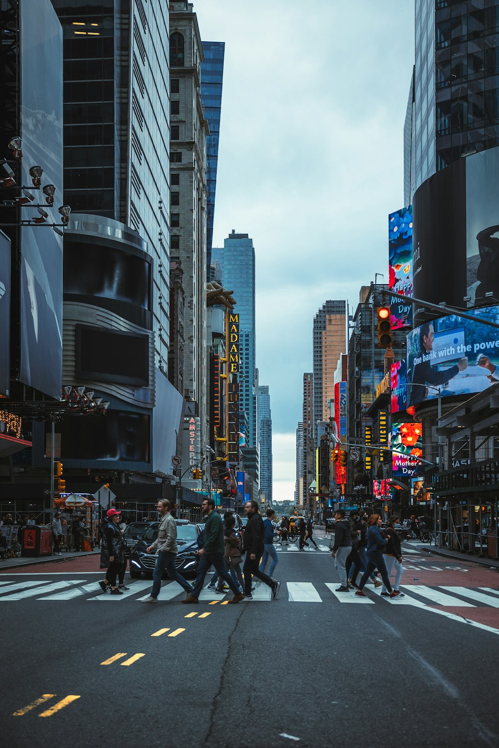 people crossing a street in Times Square