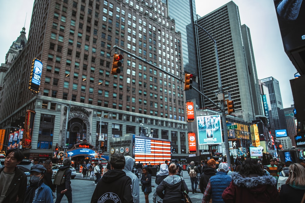 a crowd of people walking in a city