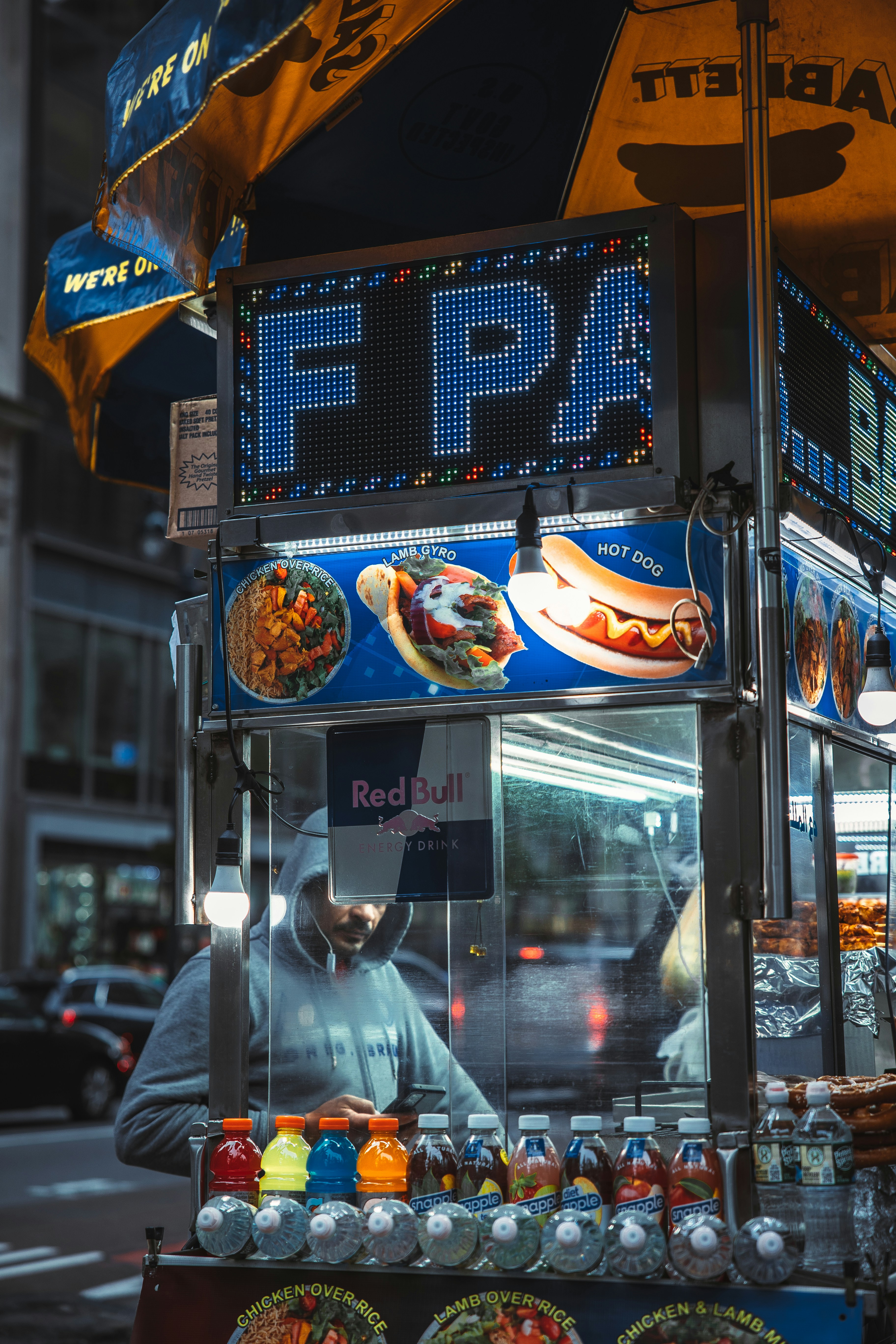 a person selling food at a street market
