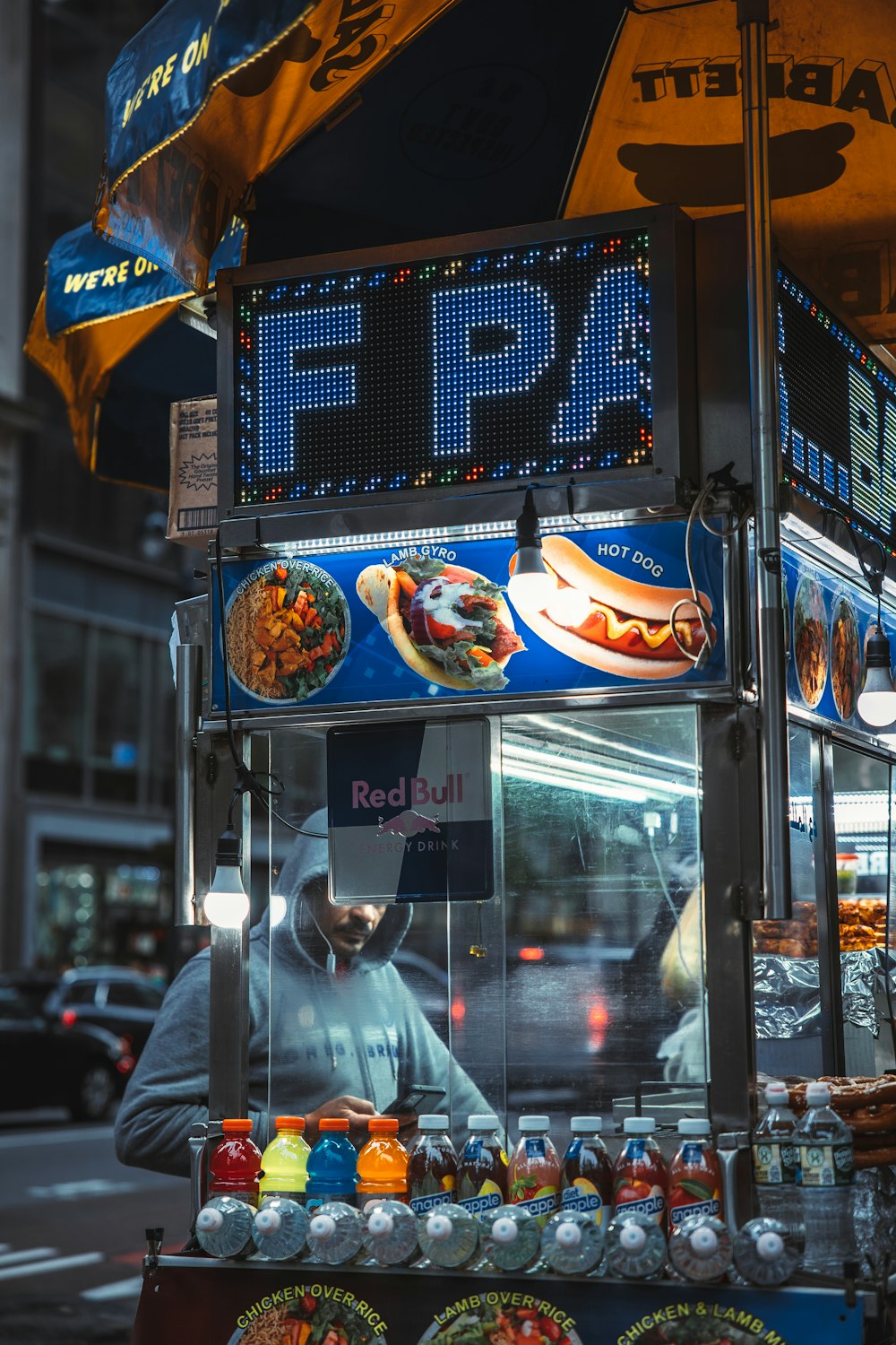 a person selling food at a street market