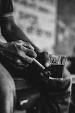 a person writing on a piece of paper