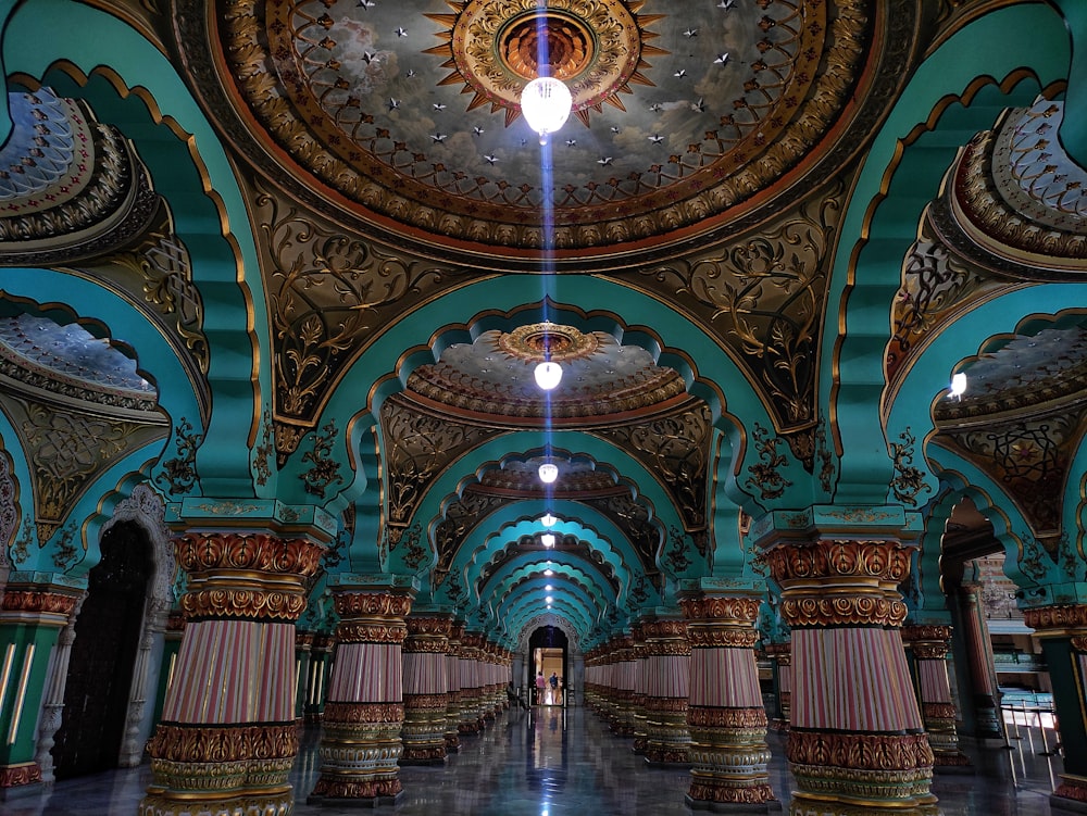 a large room with a ceiling and a chandelier