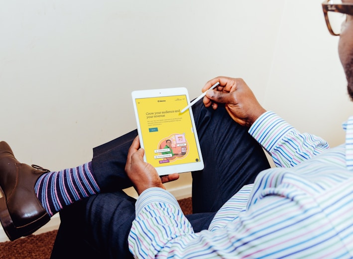 a man holding a tablet