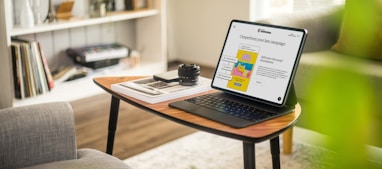 a laptop on a coffee table