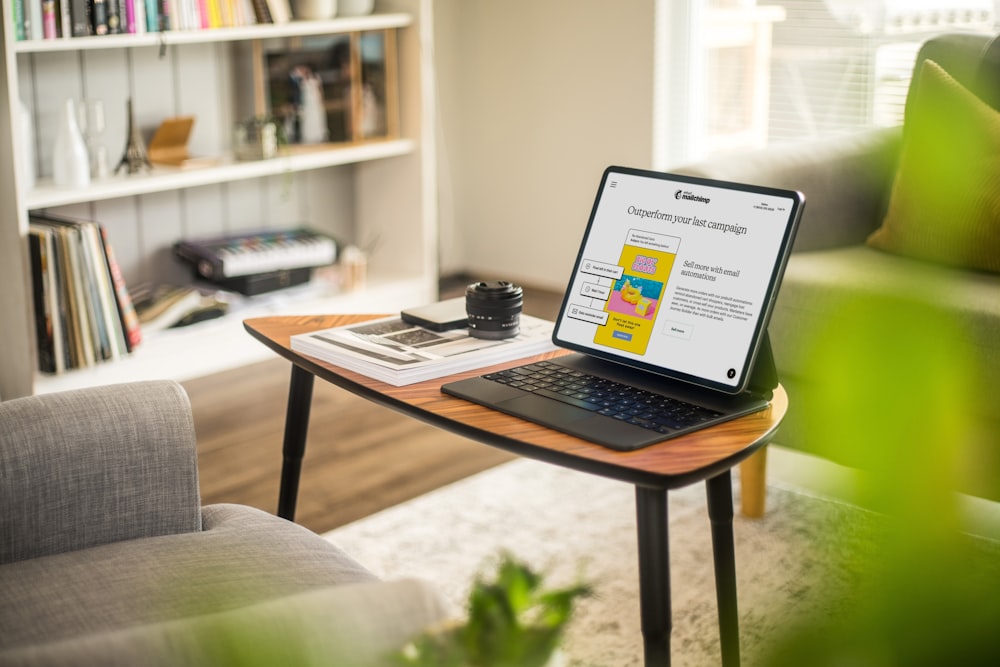 a laptop on a coffee table