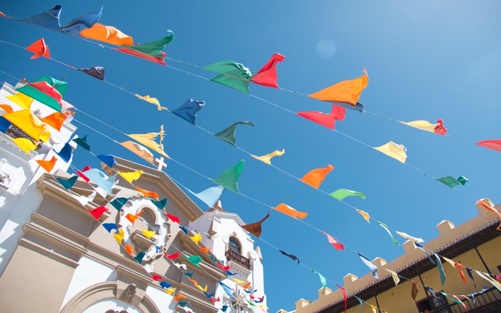 a group of colorful kites flying in the sky