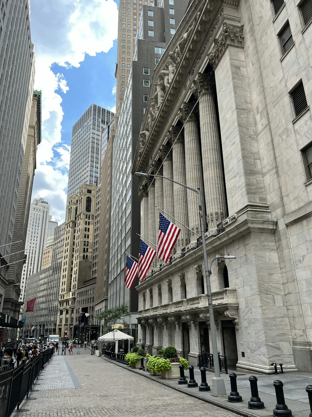 a street with buildings and flags