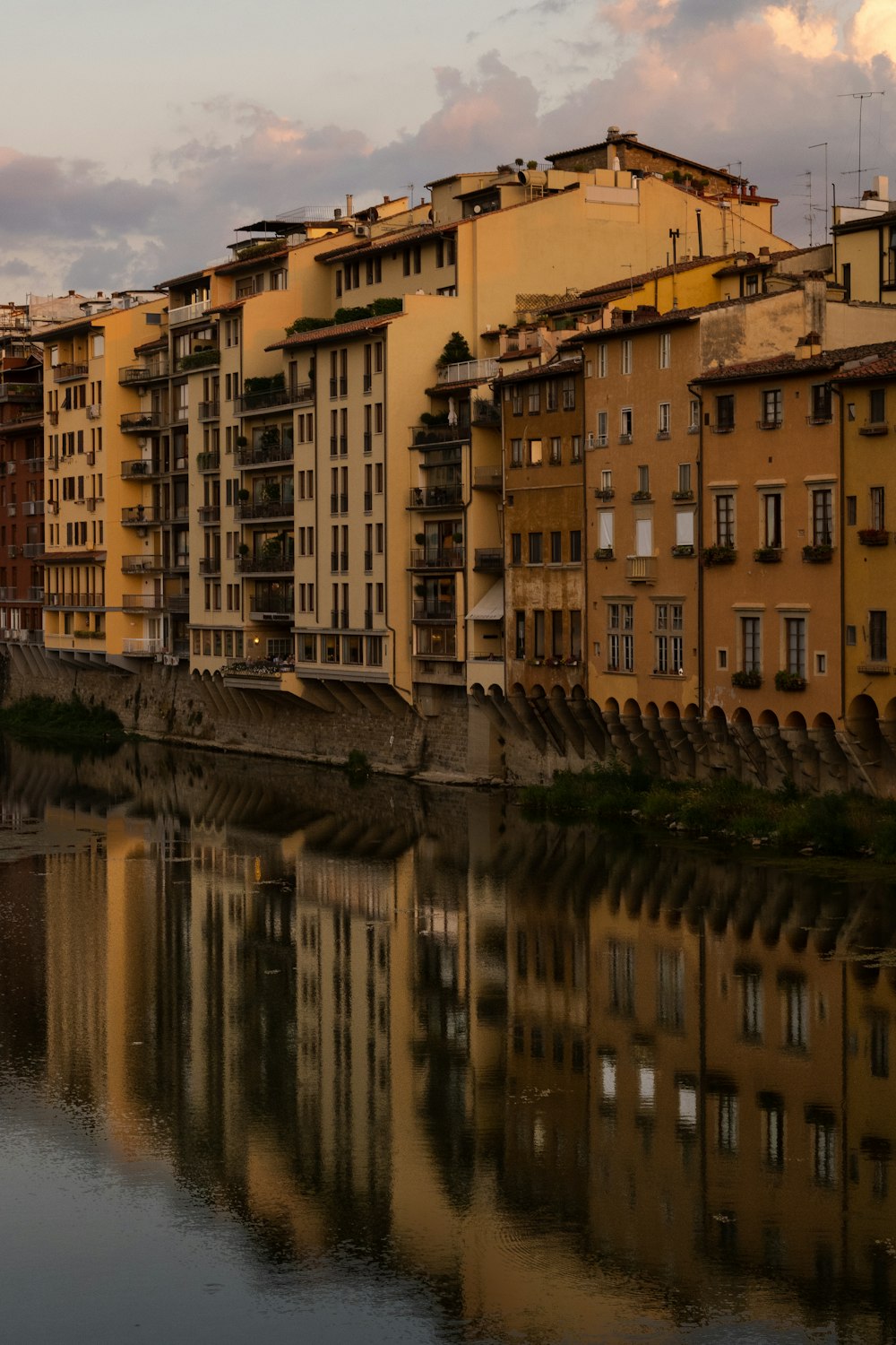 a row of buildings next to a body of water