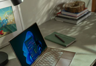 A sleek workspace with a laptop displaying a content calendar, bathed in soft Parisian light.