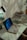 A cozy workspace with a laptop and notes, suggesting online research and learning.
