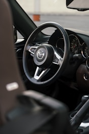 a steering wheel and dashboard of a car