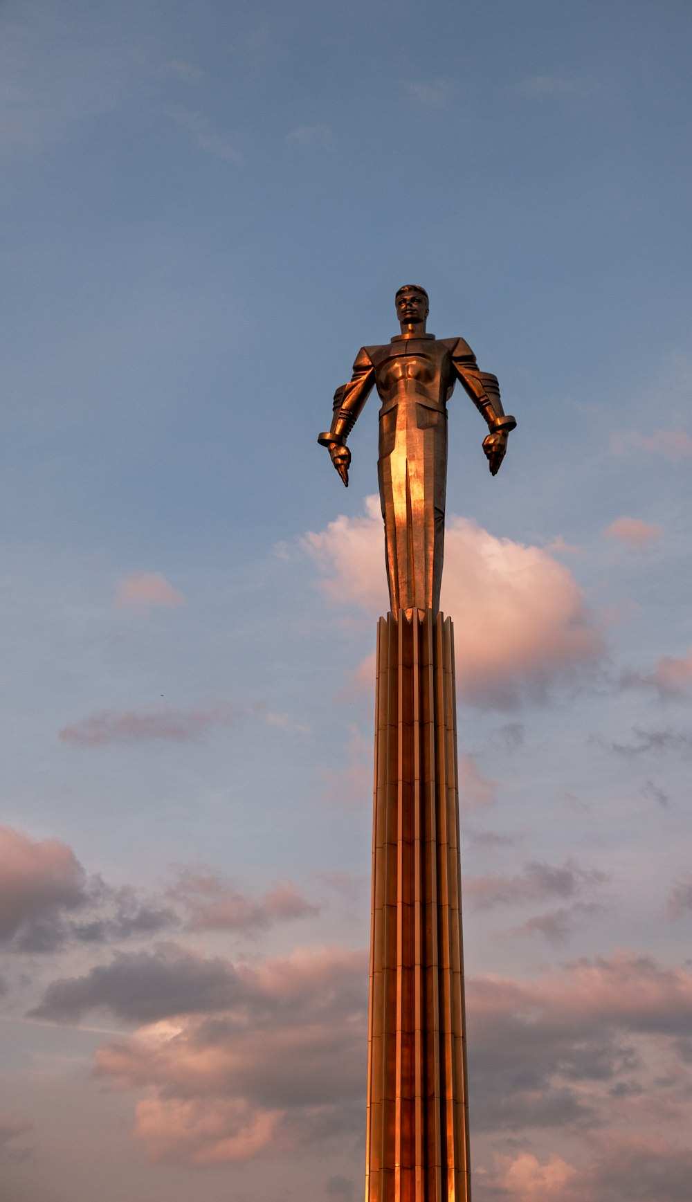 a statue of a person holding a torch