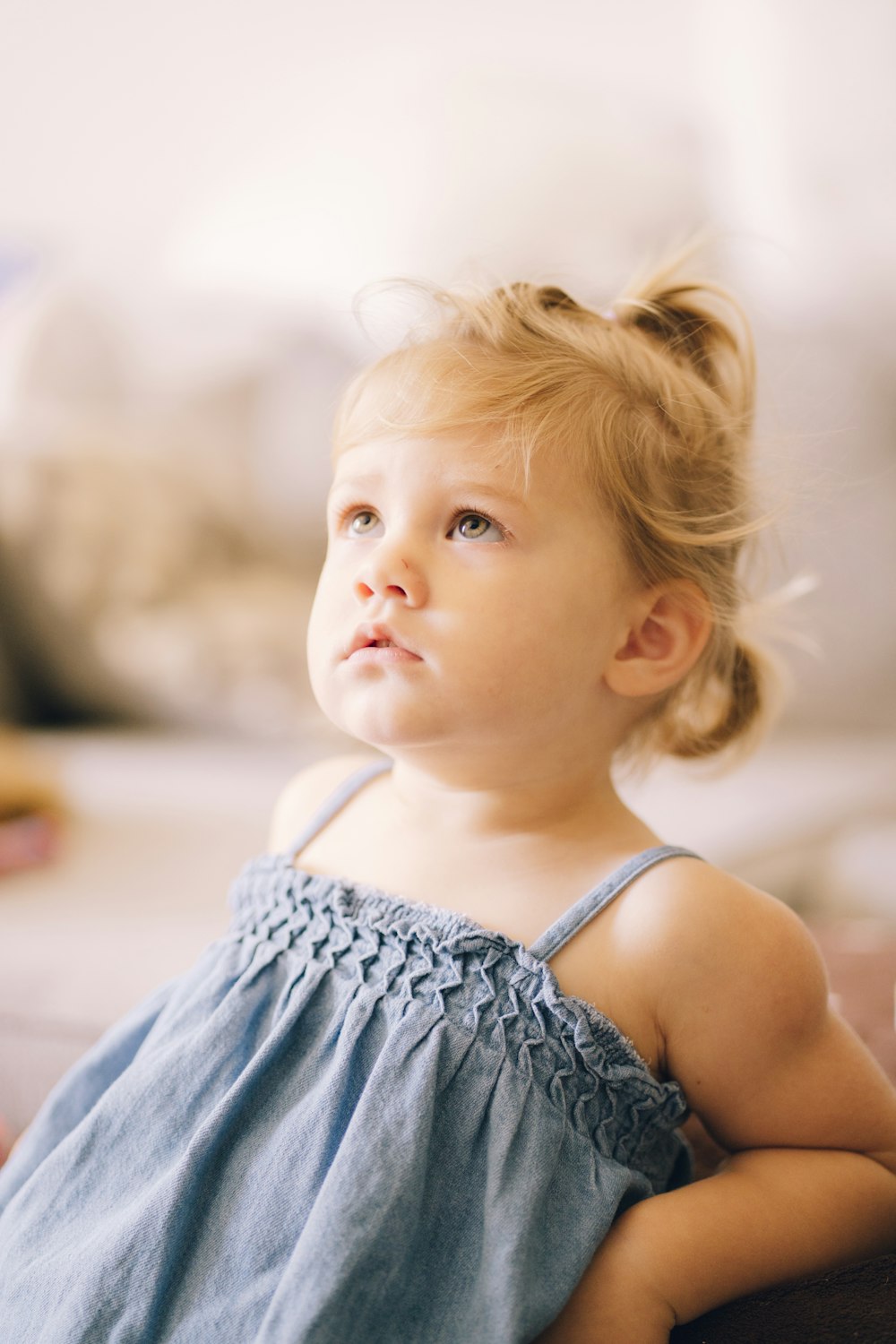 a little girl with blonde hair