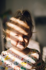 a little girl with a face mask