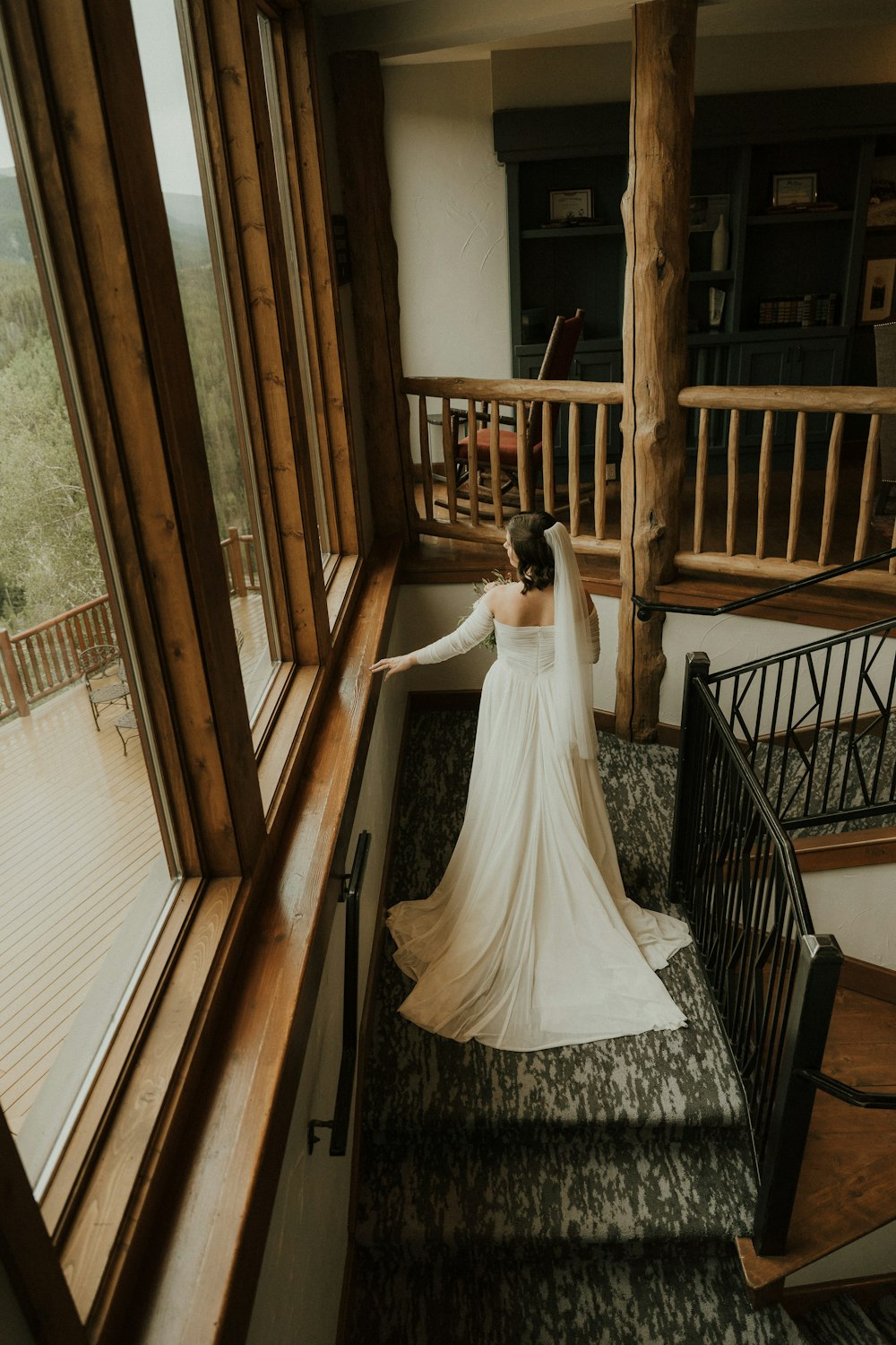 a person in a wedding dress on a staircase