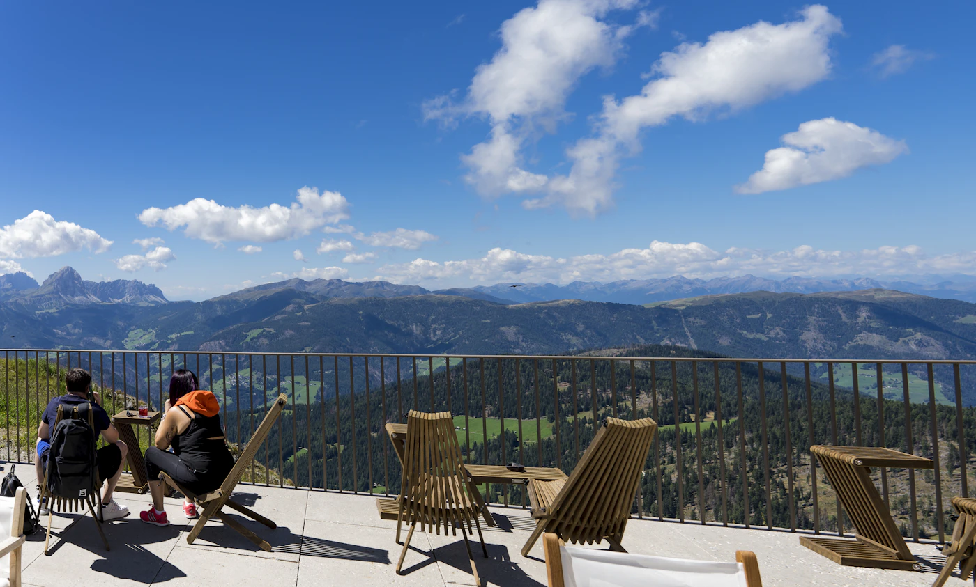An alpine hotel terrace in summer
