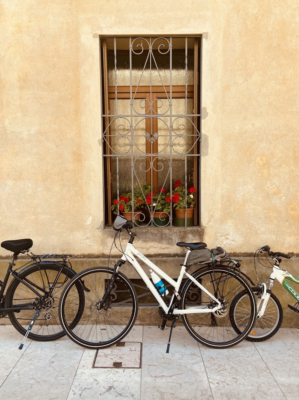 bicycles parked in front of a window