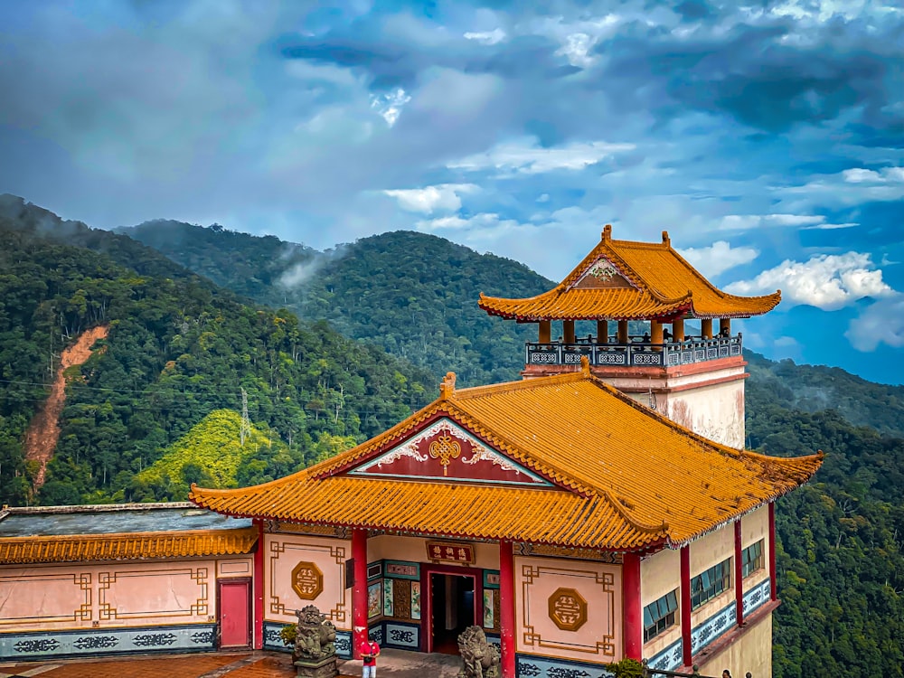 a building with a mountain in the background