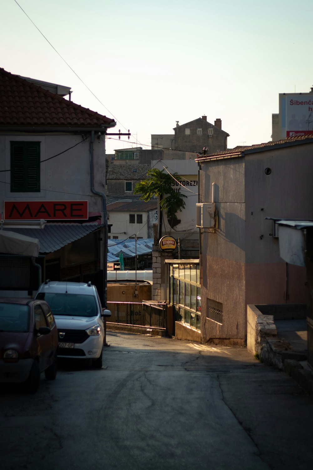 a street with cars and buildings