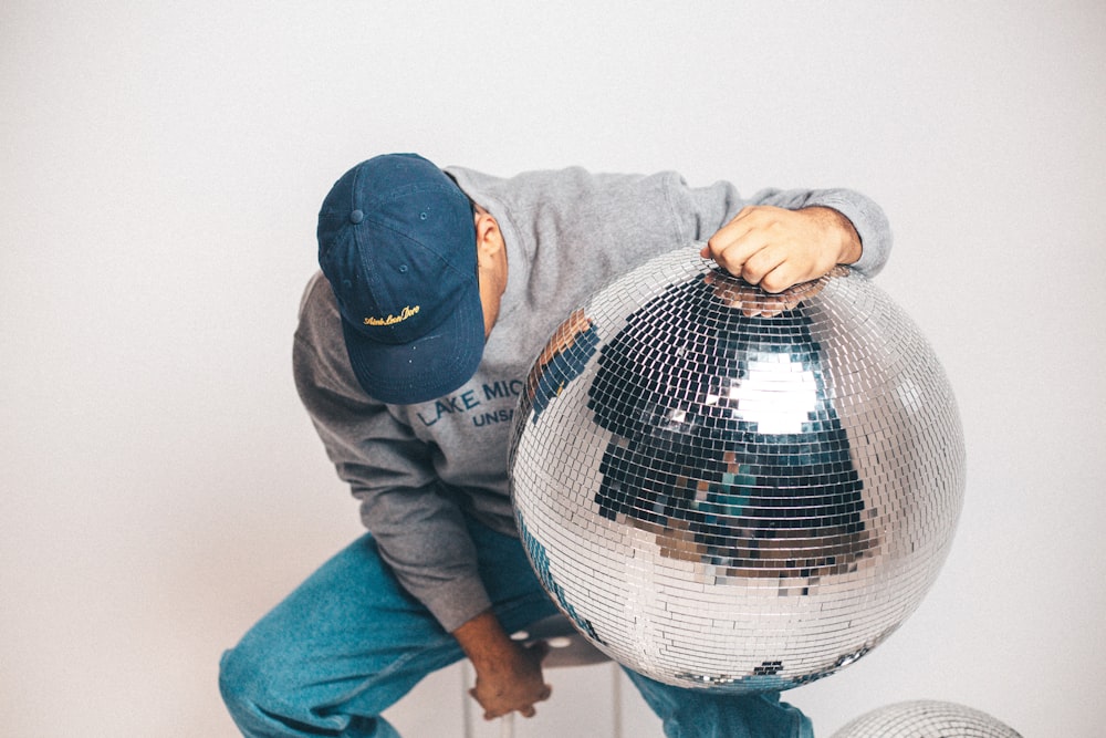 a man holding a large ball