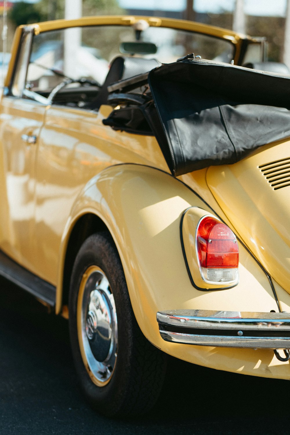 the back of a yellow car