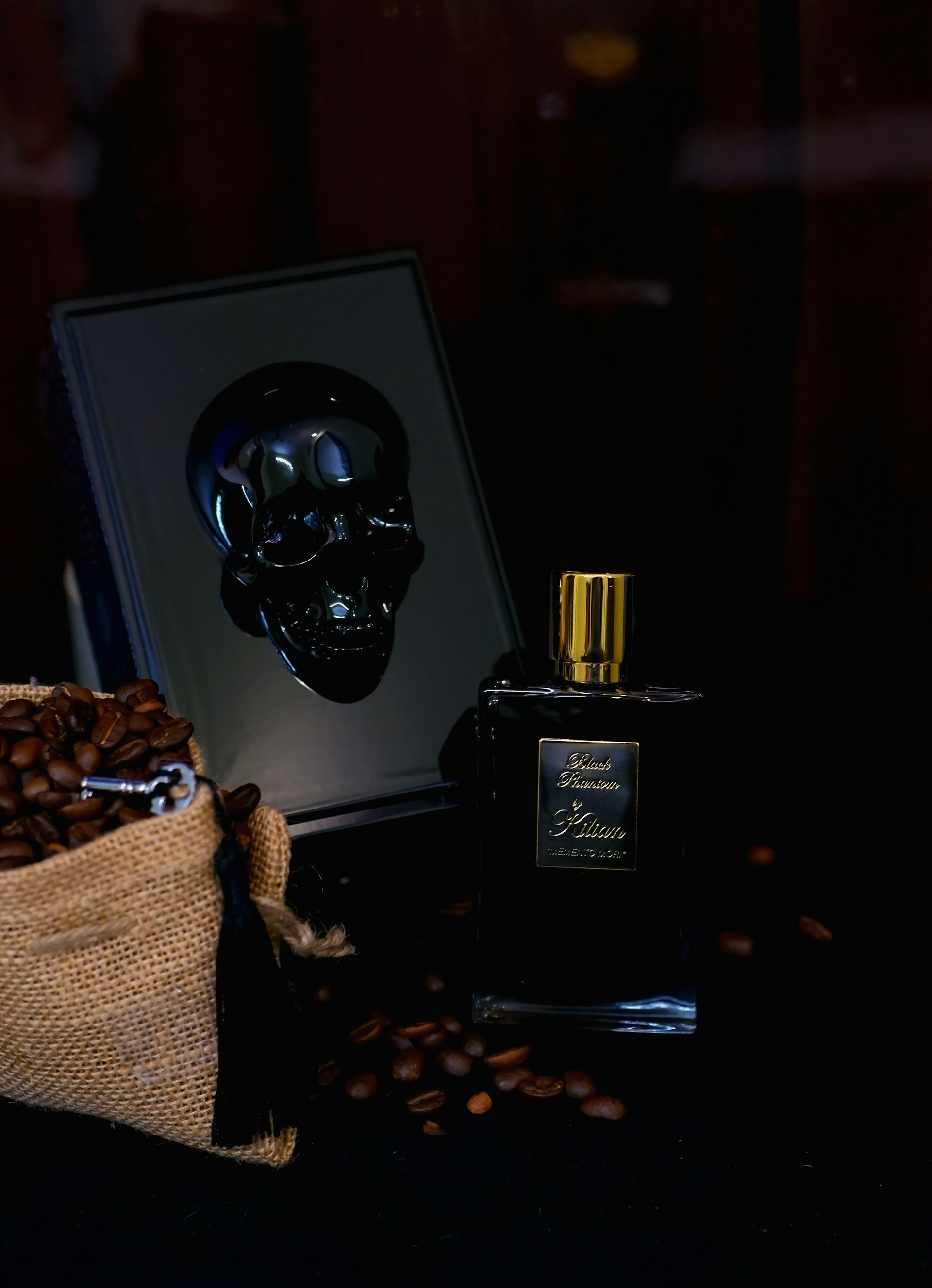 a bottle of perfume and a box of chocolates