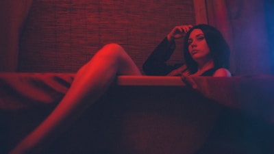 A man relaxing with a warm sitz bath in a discreet bathroom environment.