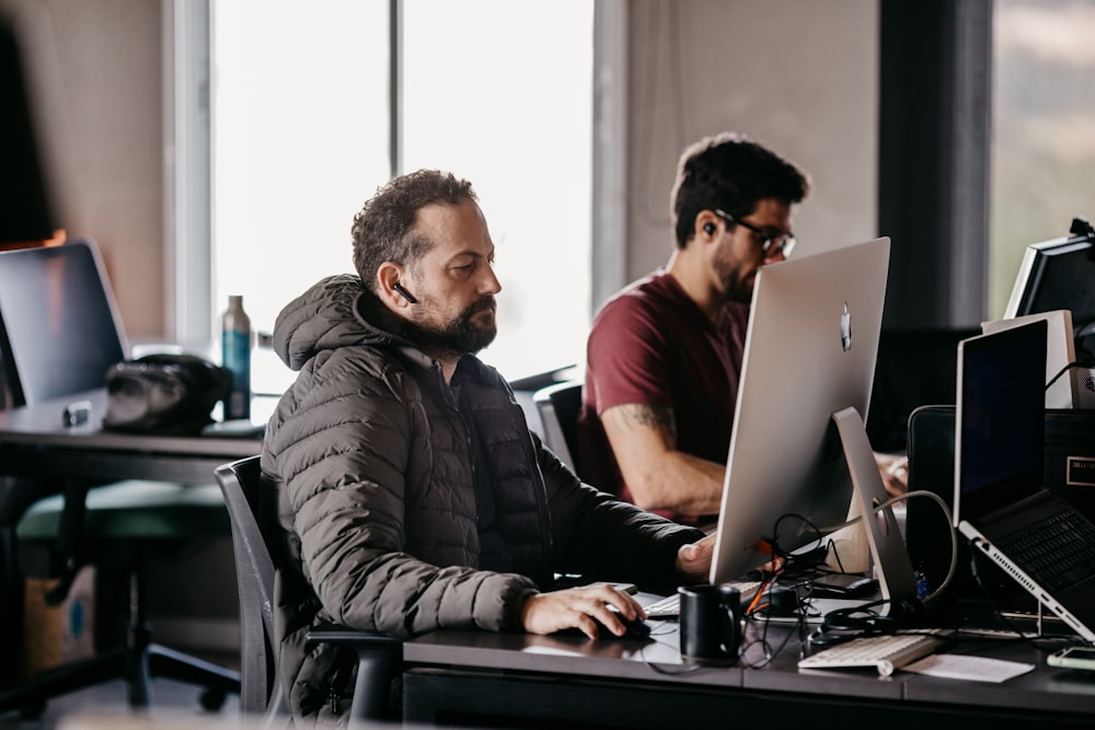 men working on computers