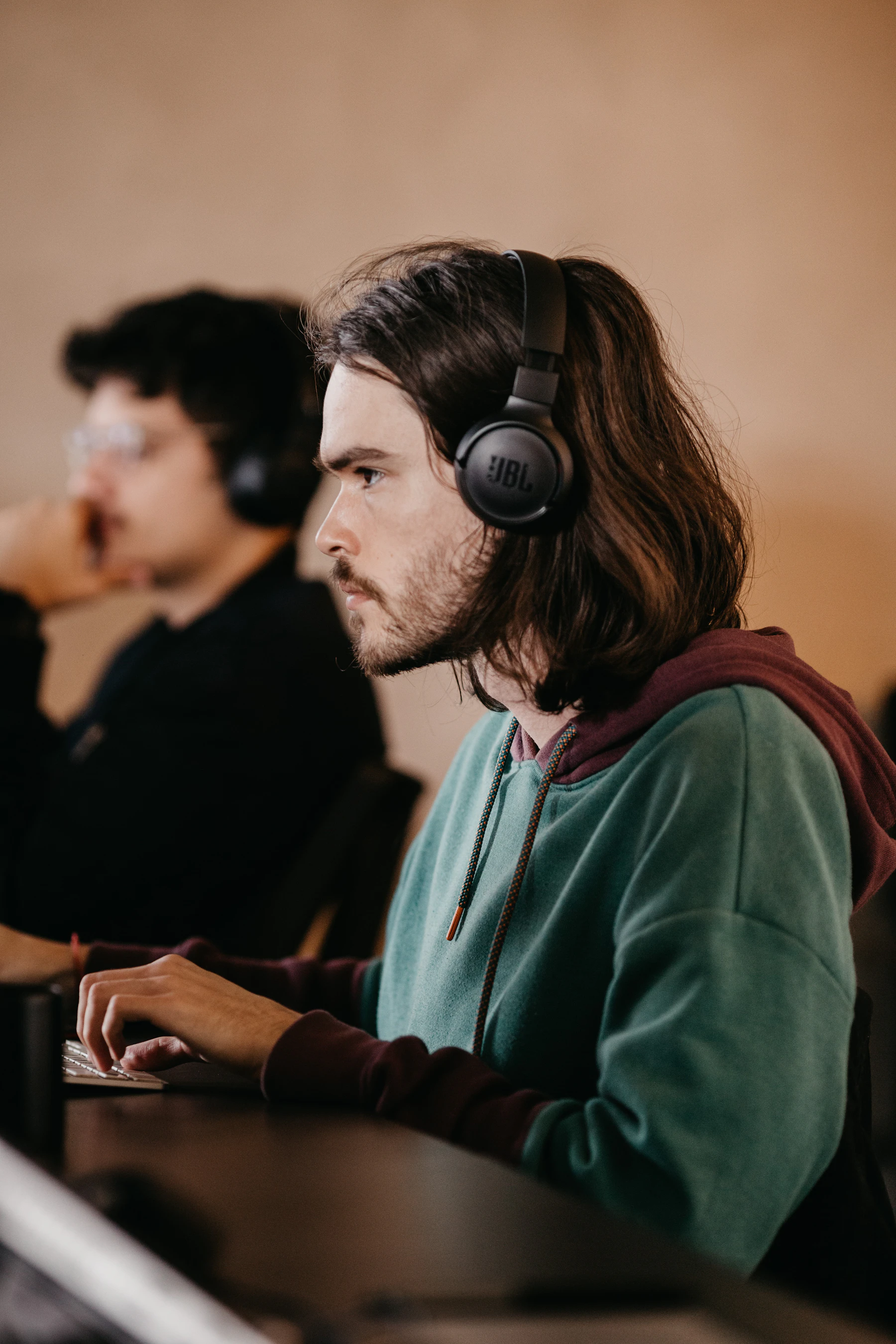 Portrait of a person wearing over-ear headphones