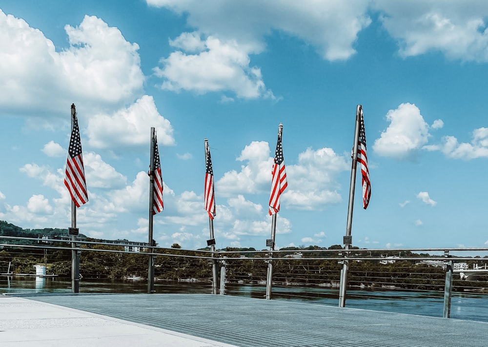 a group of flags on a dock