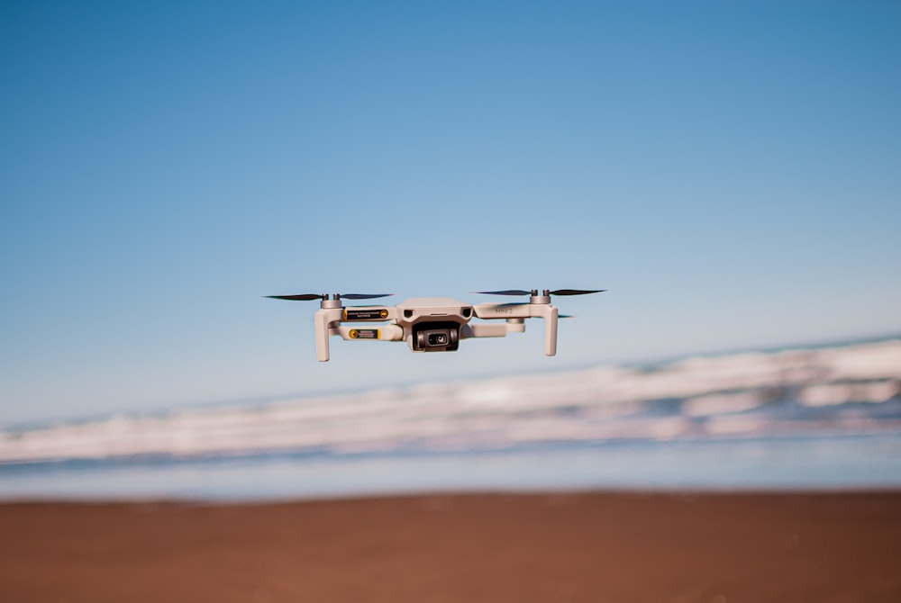 a helicopter flying over a desert