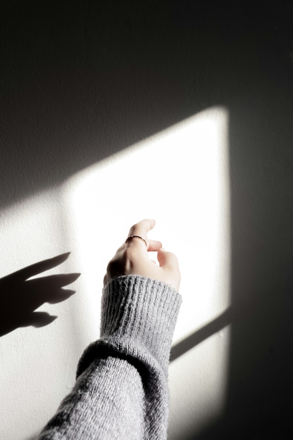 a person's hand holding a light up