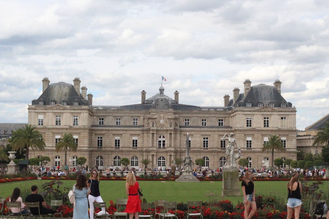 a large building with a lawn in front of it,