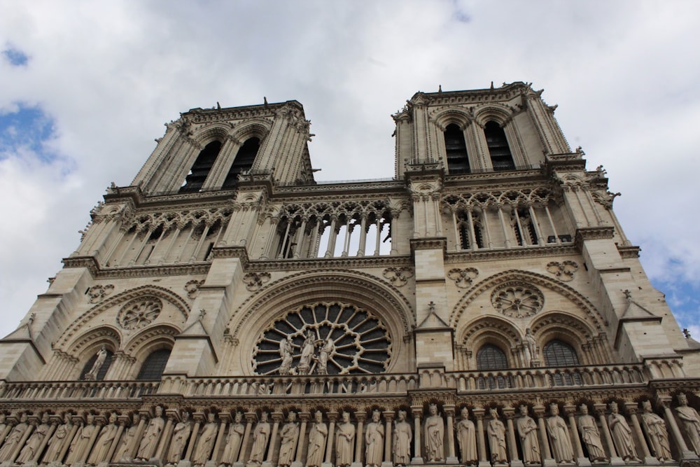 a large ornate building with Notre Dame de Paris in the background