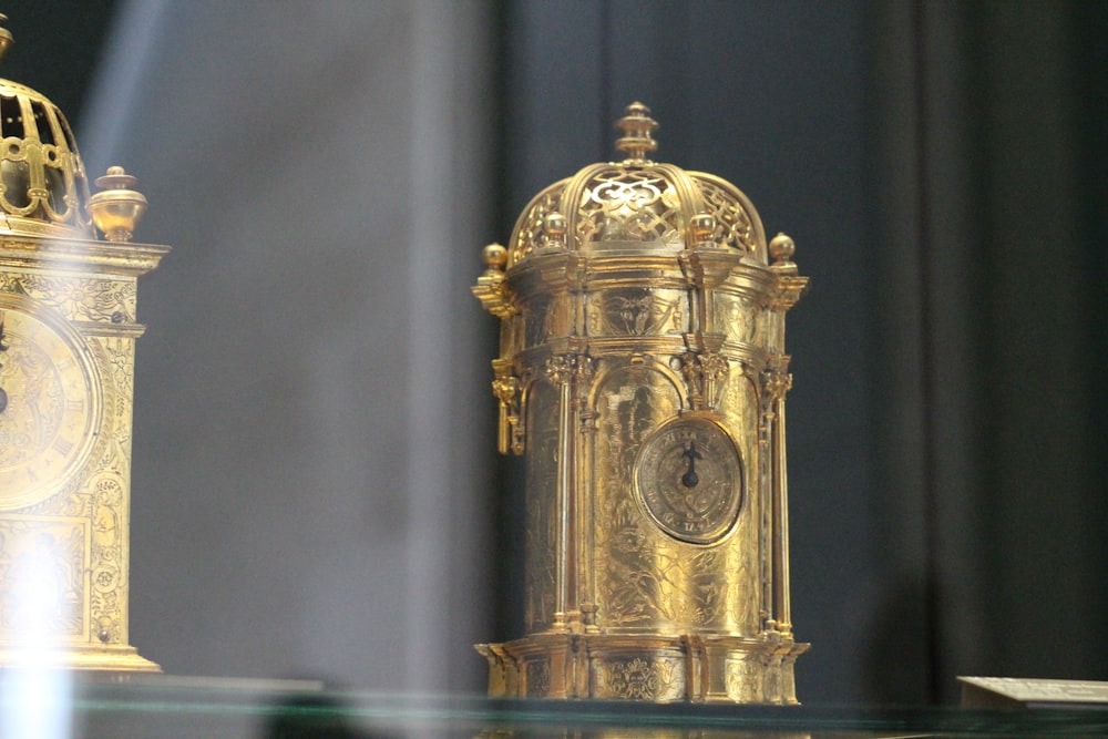 a gold and ornate clock
