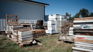 a group of pallets and a building