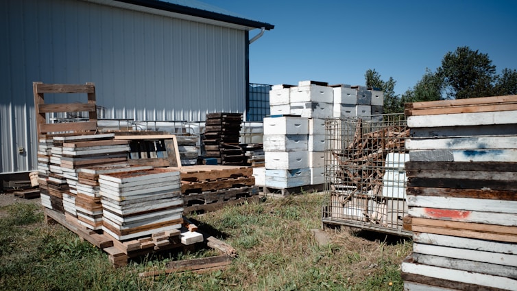 a group of pallets and a building